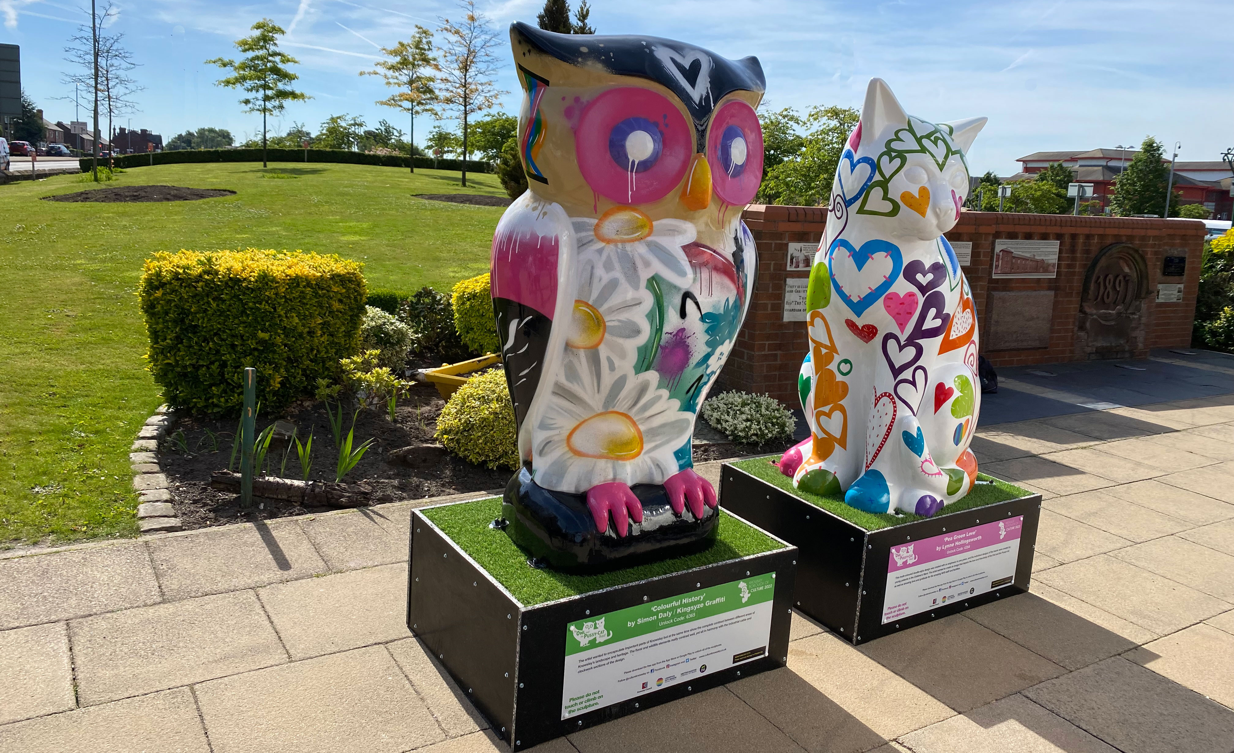 Owl and pussycat statues outside Whiston Hospital